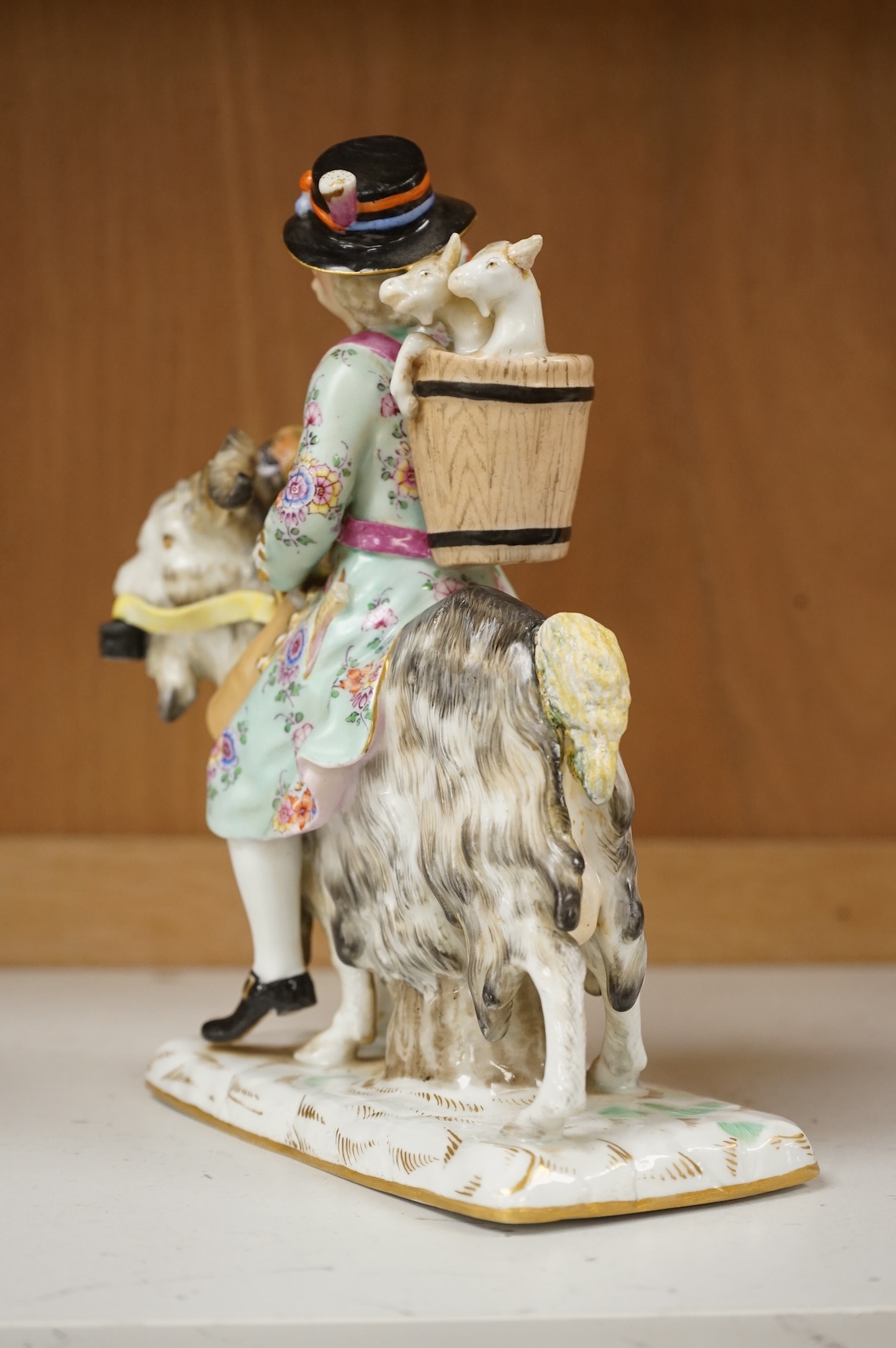 A 19th century German porcelain group of Count Von Bruhl's Tailor, 19cm wide
